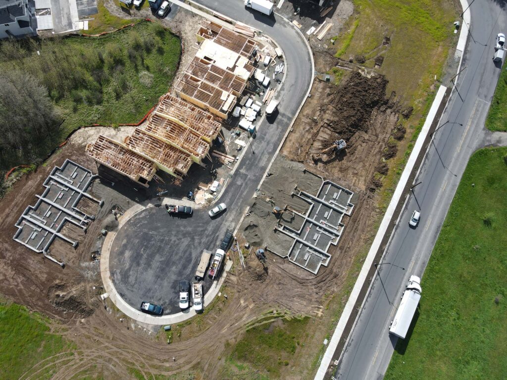 Aerial view of large construction site at the end of cul-de-sac.